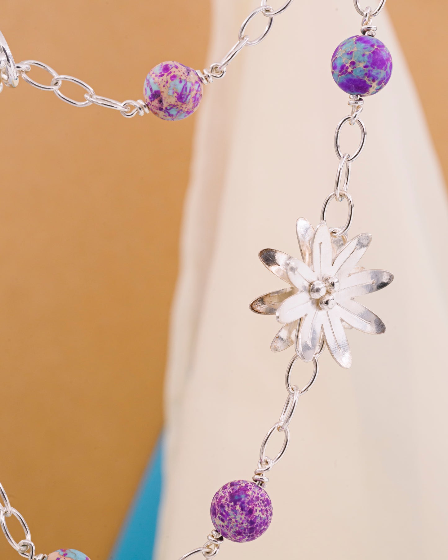 Necklace with aquamarine stone and a silver flower
