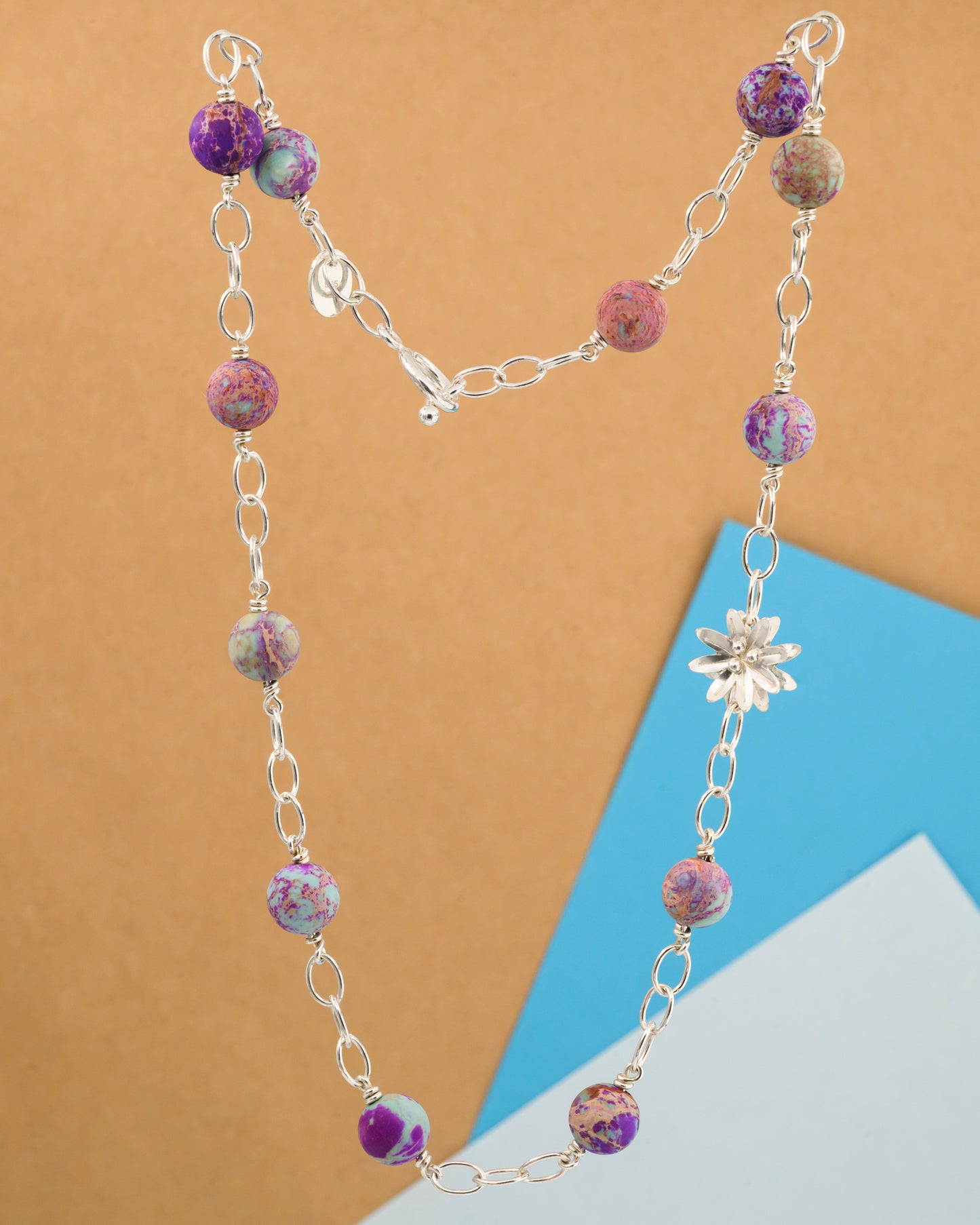 Necklace with aquamarine stone and a silver flower
