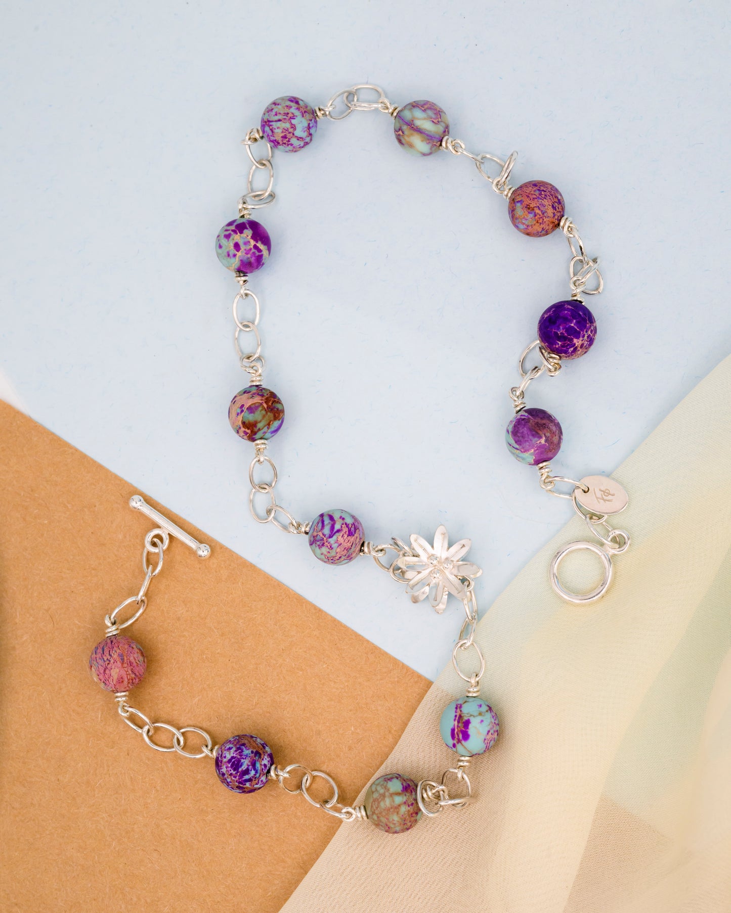 Necklace with aquamarine stone and a silver flower