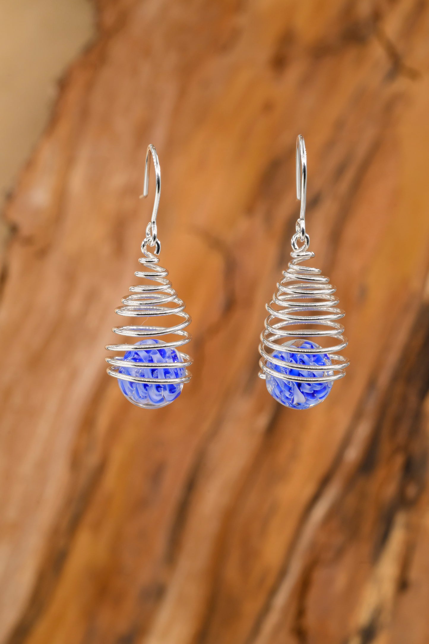 Spiral earring hangers with blue-striped glass balls