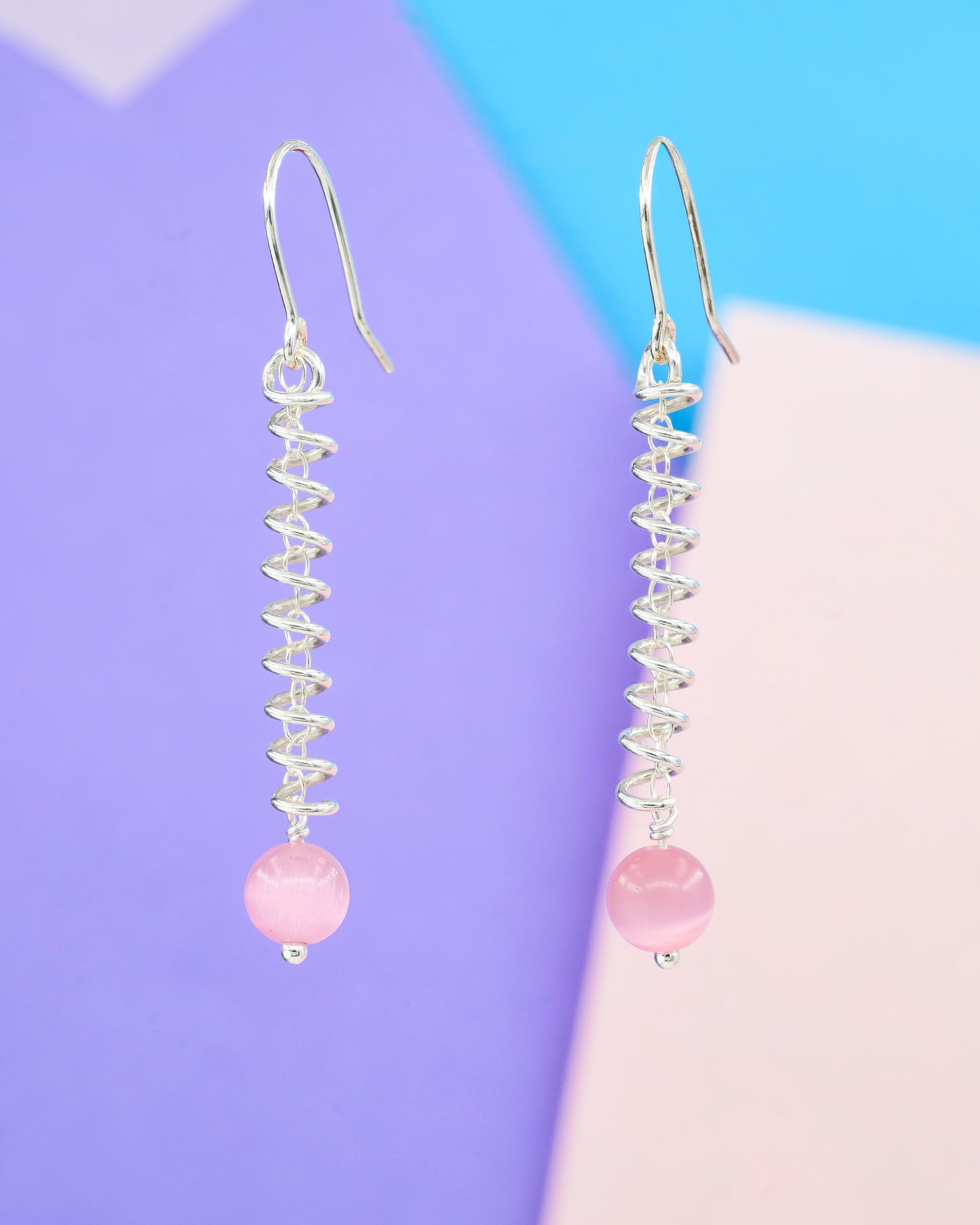 Narrow spiral earrings with pink cat's eye