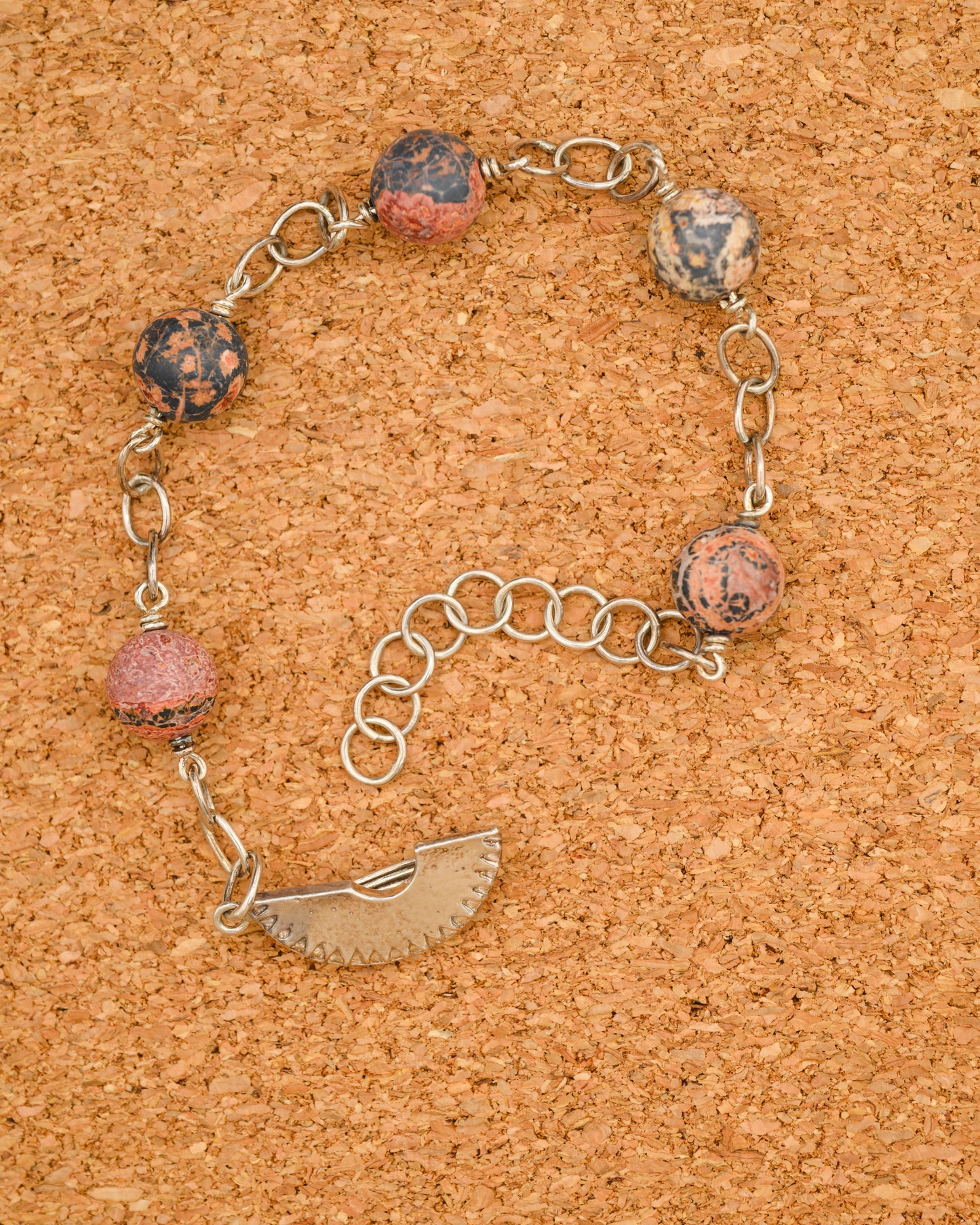 Silver bracelet with red pictorial jasper and compass dial